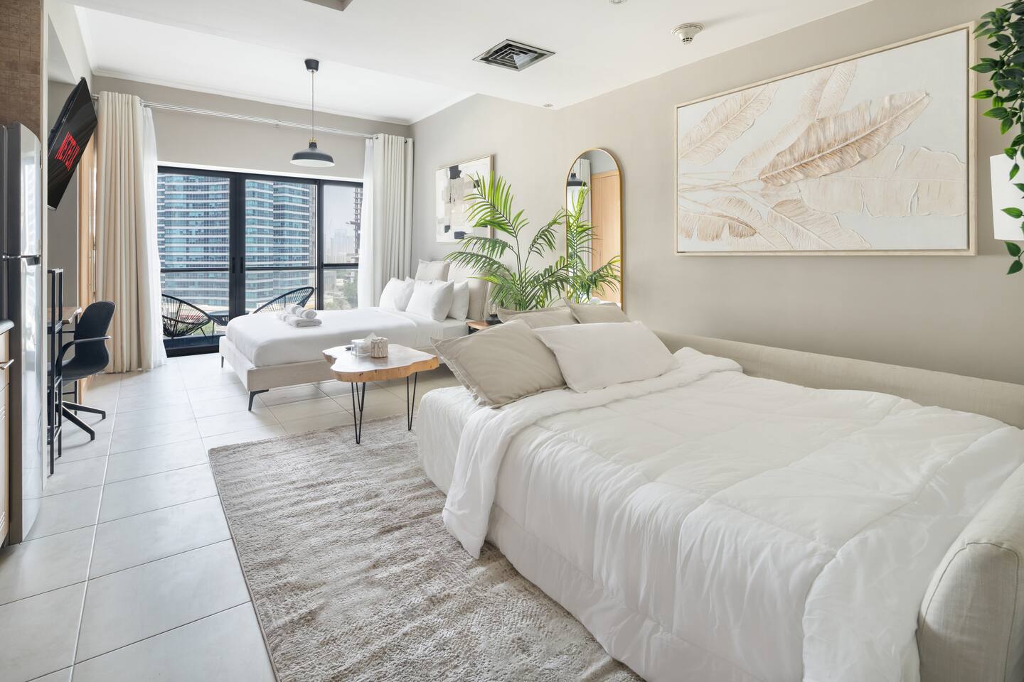 Wide sofa bed with extra linens and pillows